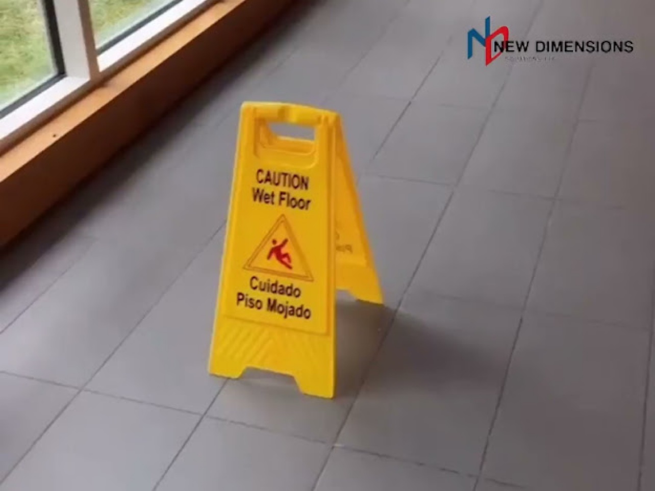Wet floor caution sign on a slippery floor